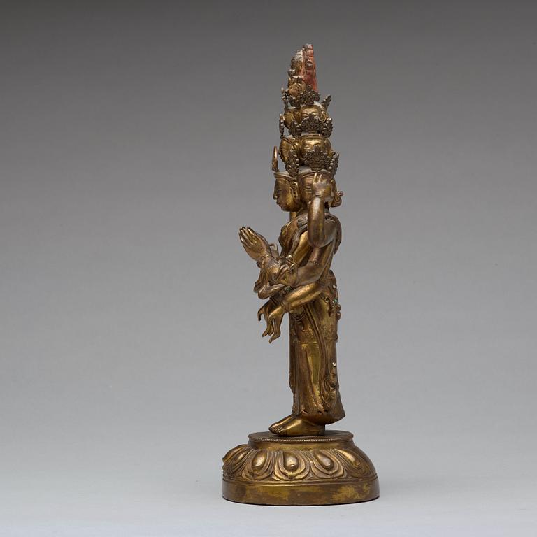 A Tibeto-Chinese gilt bronze figure of eleven-headed Avalokiteshvara, 19th Century.