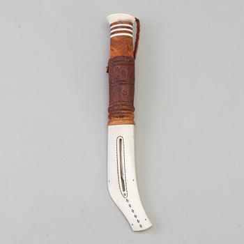 A traditional sami knife by Tore Sunna in Kiruna. Signed.