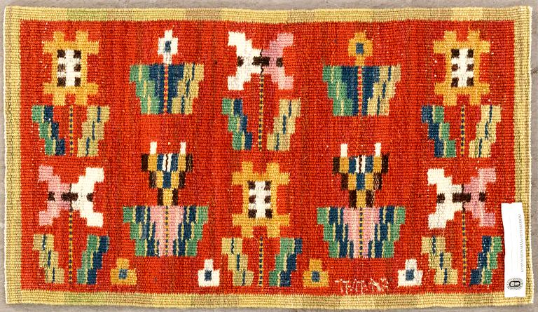 MÄRTA MÅÅS-FJETTERSTRÖM -  A TEXTILE,"Blommor på röd botten", flat weave, signed AB MMF,