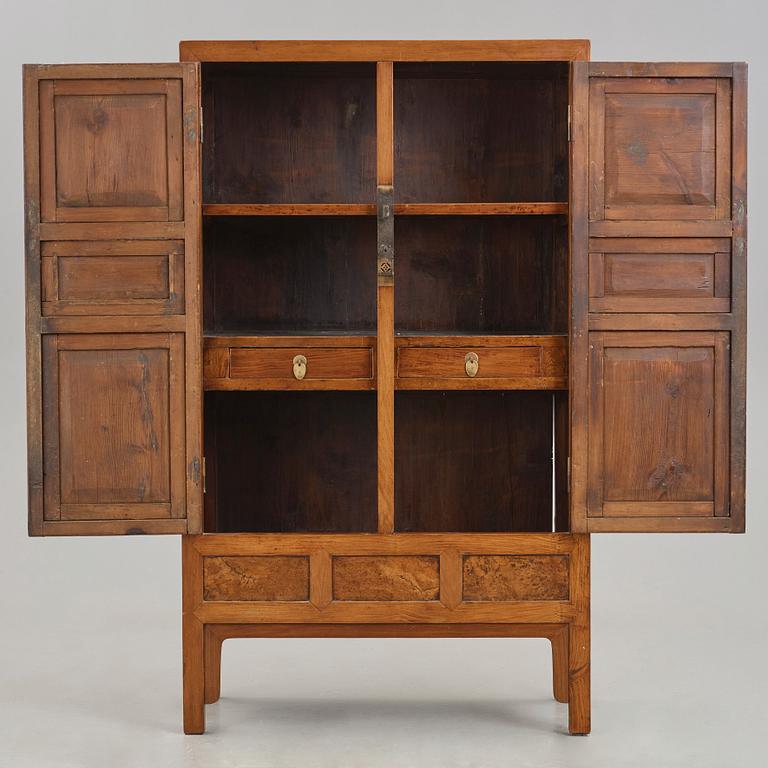 A huanghuali veneered, huamu and mixed wood cabinet, 19th century, Qing dynasty, 19th Century.