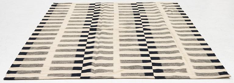 A flat-woven rug, c. 232 x 175 cm.
