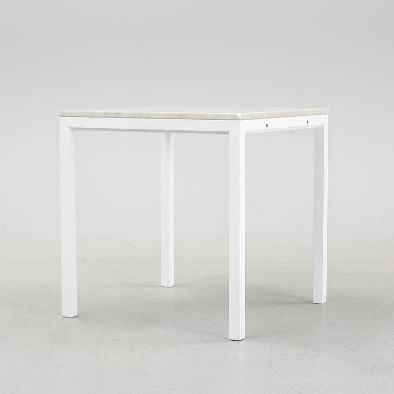 A marble top table, 21th century.