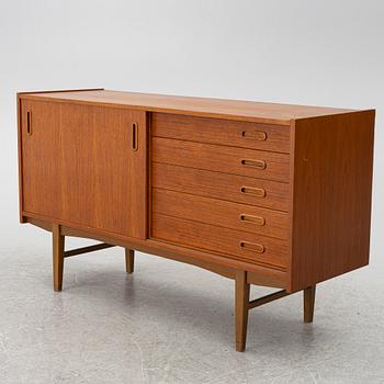 A 1950's teak veneered sideboard.
