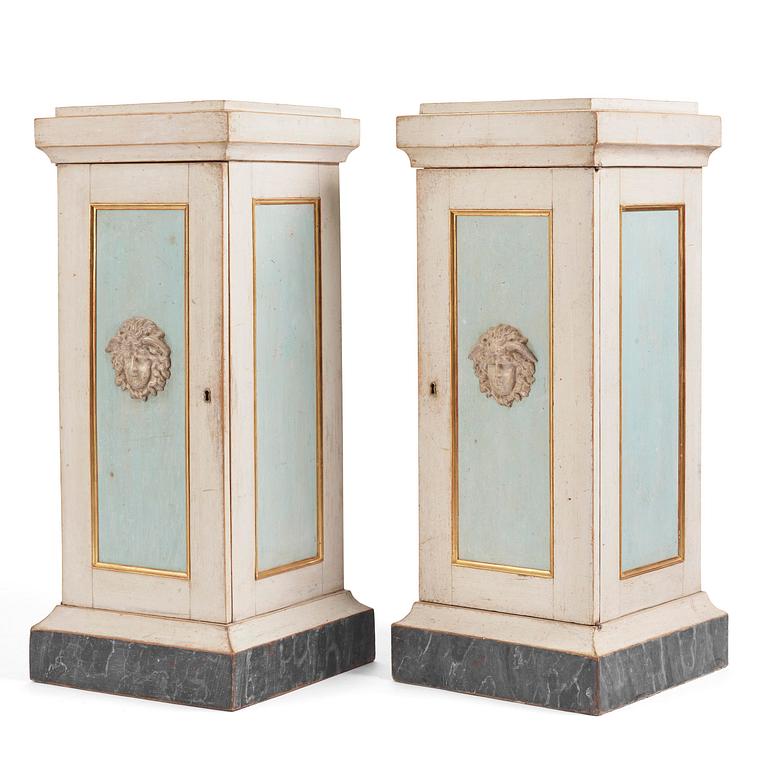 A pair of late Gustavian-style column-shaped cabinets, Stoockholm, early 19th century and later.