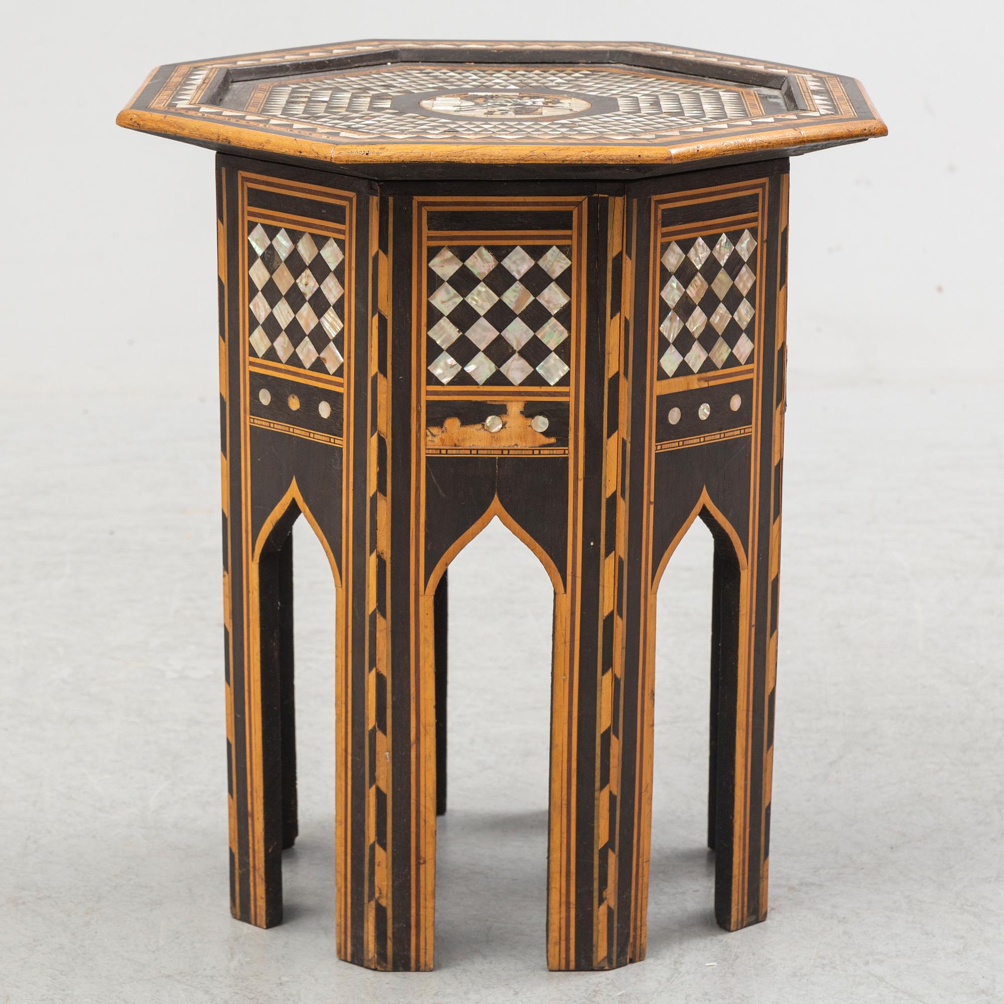 A mother of pearl and wood small table, 20th century.