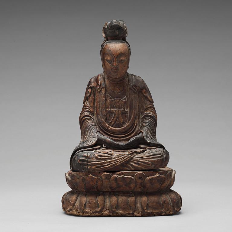 A lacquered and gilded wooden figure of Guanyin, Ming dynasty (1368-1664).