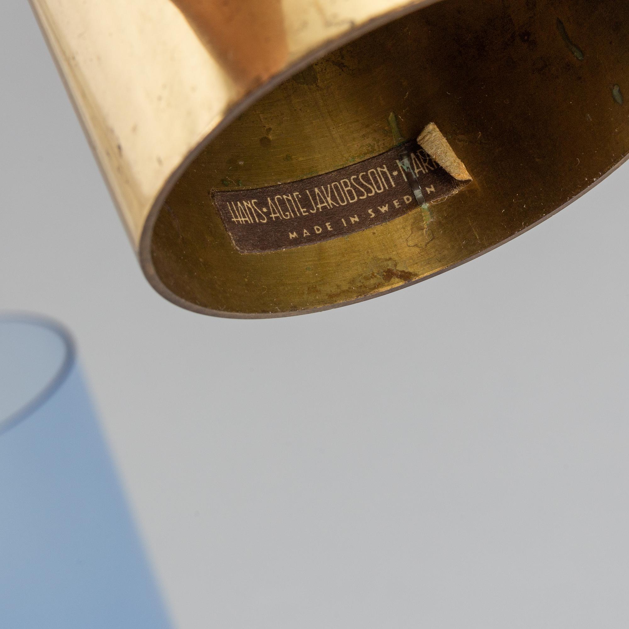 Hans-Agne Jakobsson, a brass and glass candle holder from Markaryd.