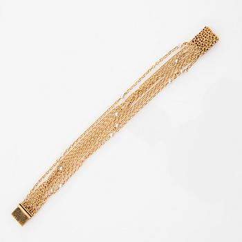 Bracelet 18K gold and seed pearls.