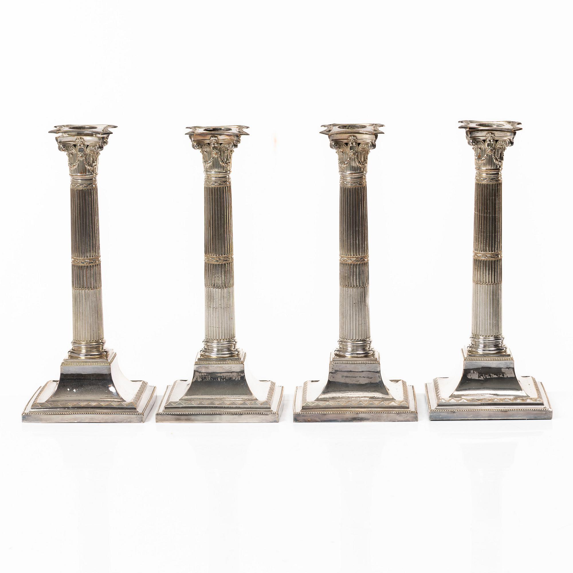 Four silver plated candlesticks, early 20th century.