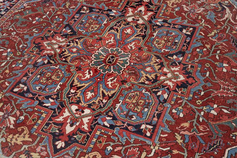 An Antique Heriz carpet, North west persia, c. 380 x 310 cm.