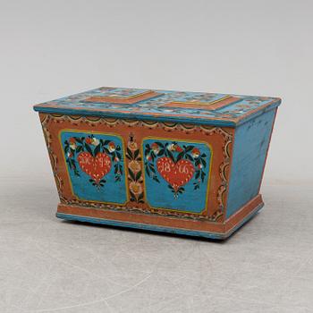 A painted pine chest from Dalsbo, Hälsingland, dated 1866.