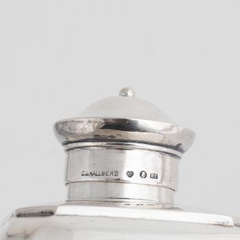 A silver tea caddy, a sugarbowl and a napkin ring, including K. Anderson, Stockholm 1920.