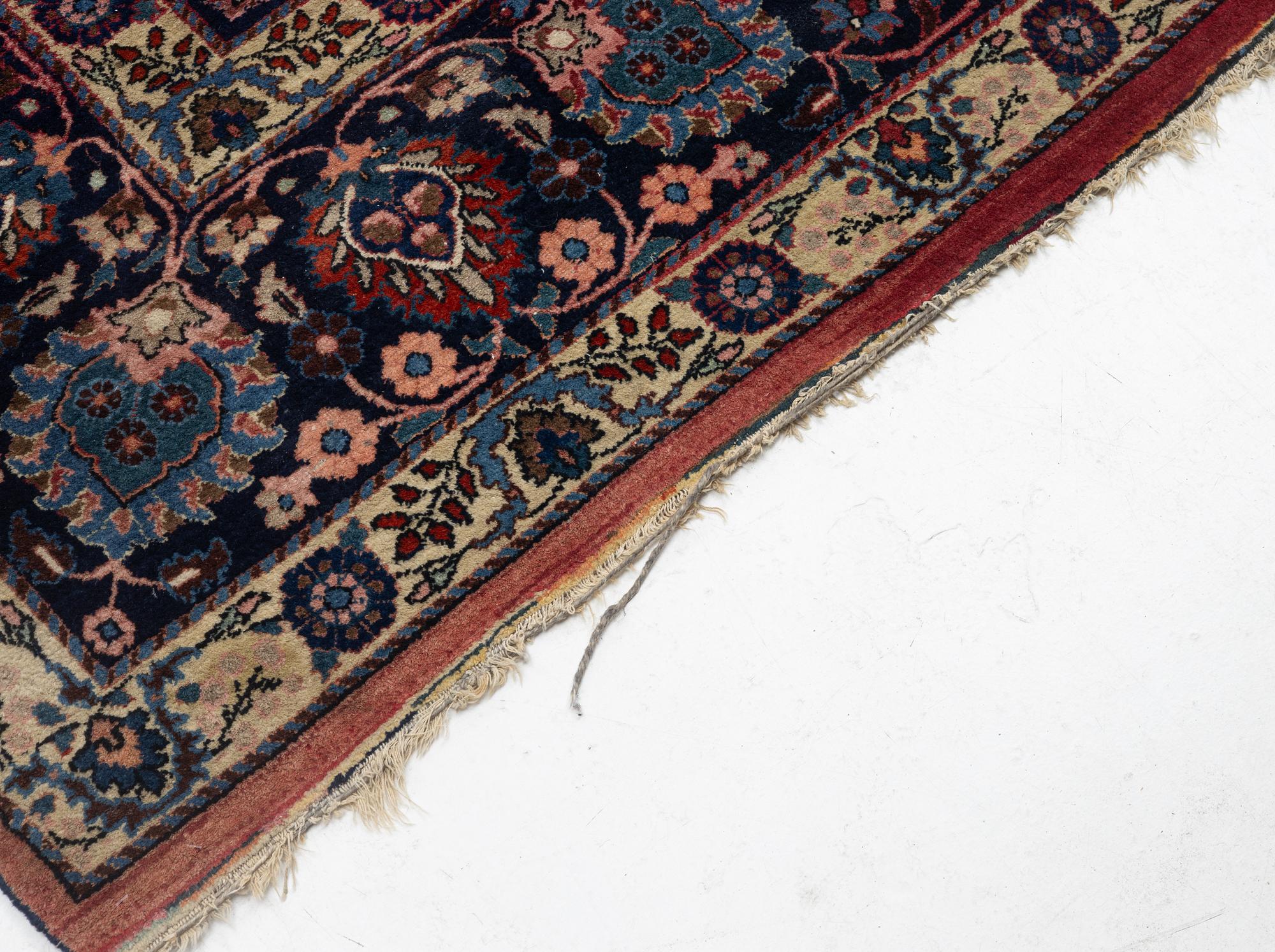 A semi-antique Mashad carpet, Eastern Iran, signed c. 507 x 303 cm.