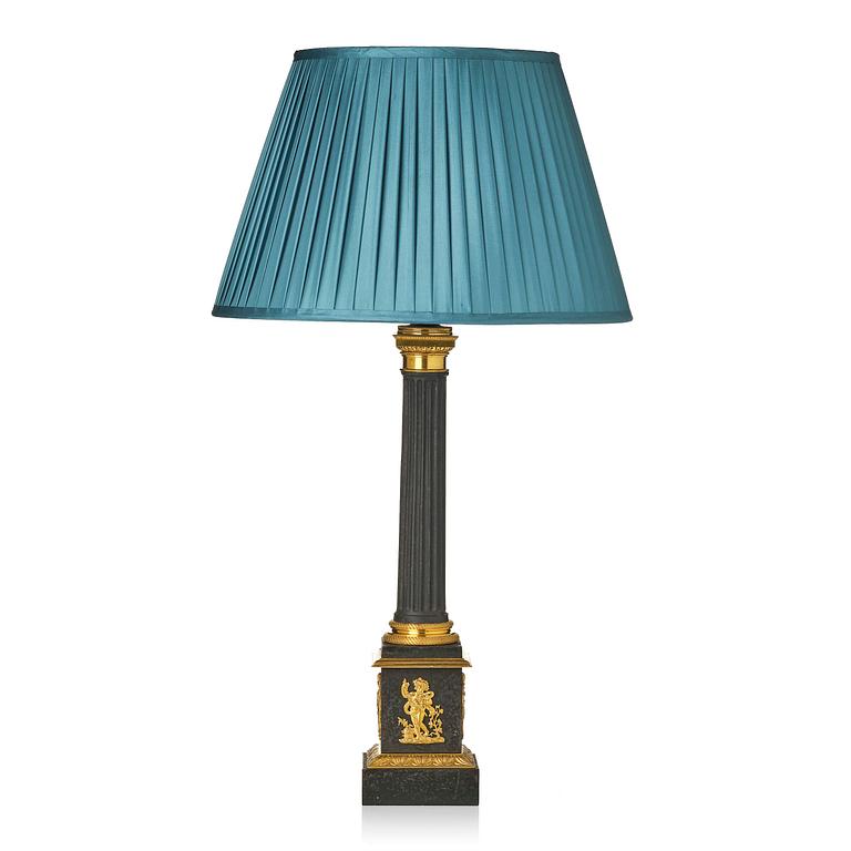 A French Empire ormolu and tole lamp, early 19th century.