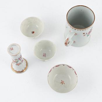 A Chinese porcelain set of cups, saucers and vase, Qing Dynasty, mostly Qianlong (1736-95) (13 pieces).