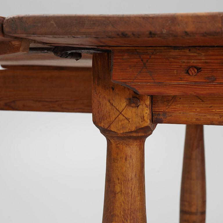 A drop-leaf table, 18th Century.