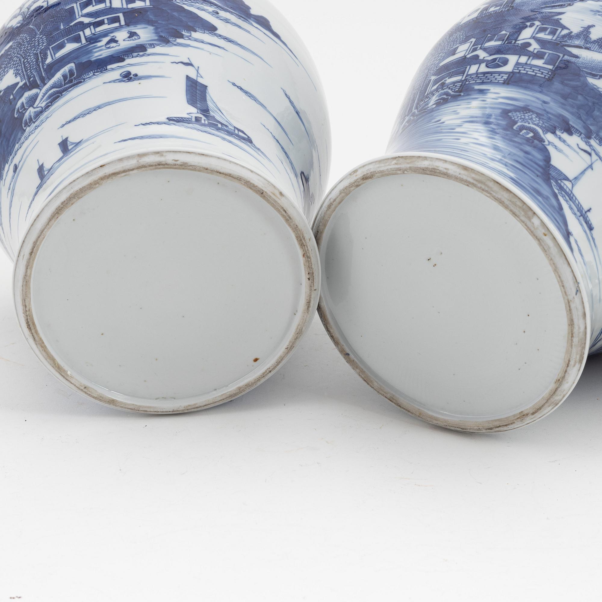 A pair of blue and white Chinese porcelain jars with covers. Qing dynasty, Qianlong (1736-95).