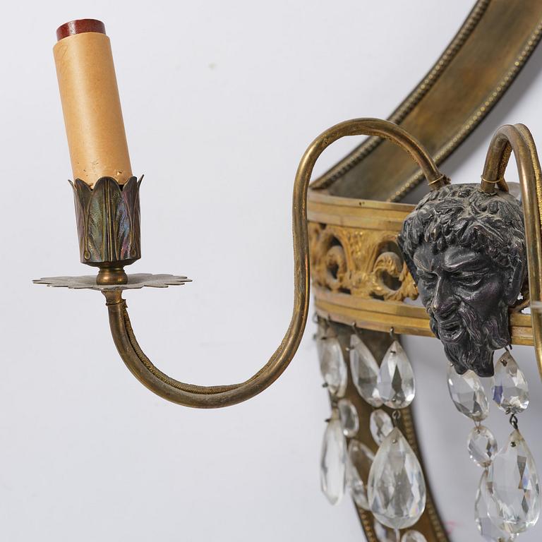 A pair of Russian Louis XVI-style  four-branch gilt bronze appliques, 19th century.