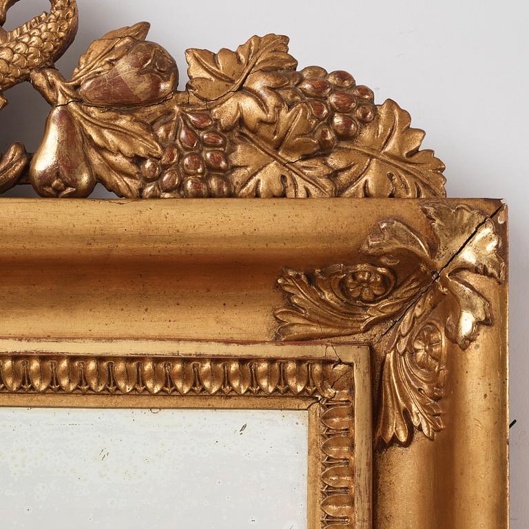 A pair of Swedish Empire two-light girandole mirrors, first half of the 19th century.