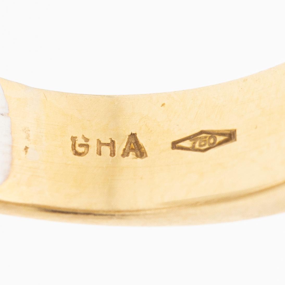 18K gold and white gold ring.