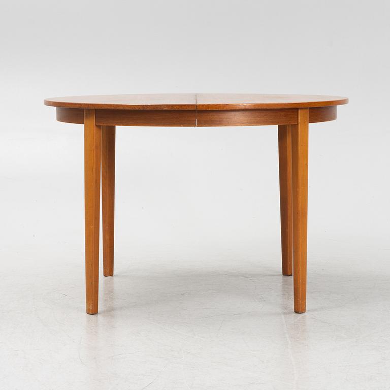 A teak-veneered dining table, second half of the 20th century.