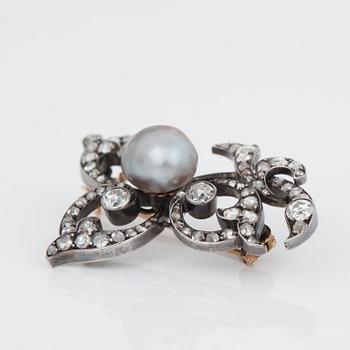 A late Victorian brooch set with a grey natural pearl and old- and rose-cut diamonds.