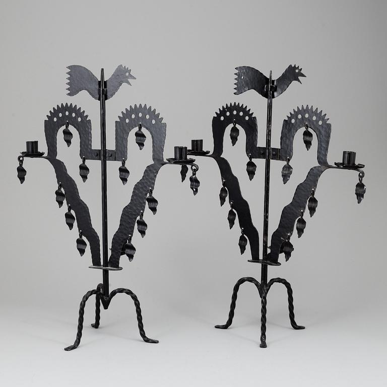 KANDELABRAR , 2 st smide, "Tuppljusstake" Design Gustaf Ancarkrona, Käck & Hedbys, Leksand.