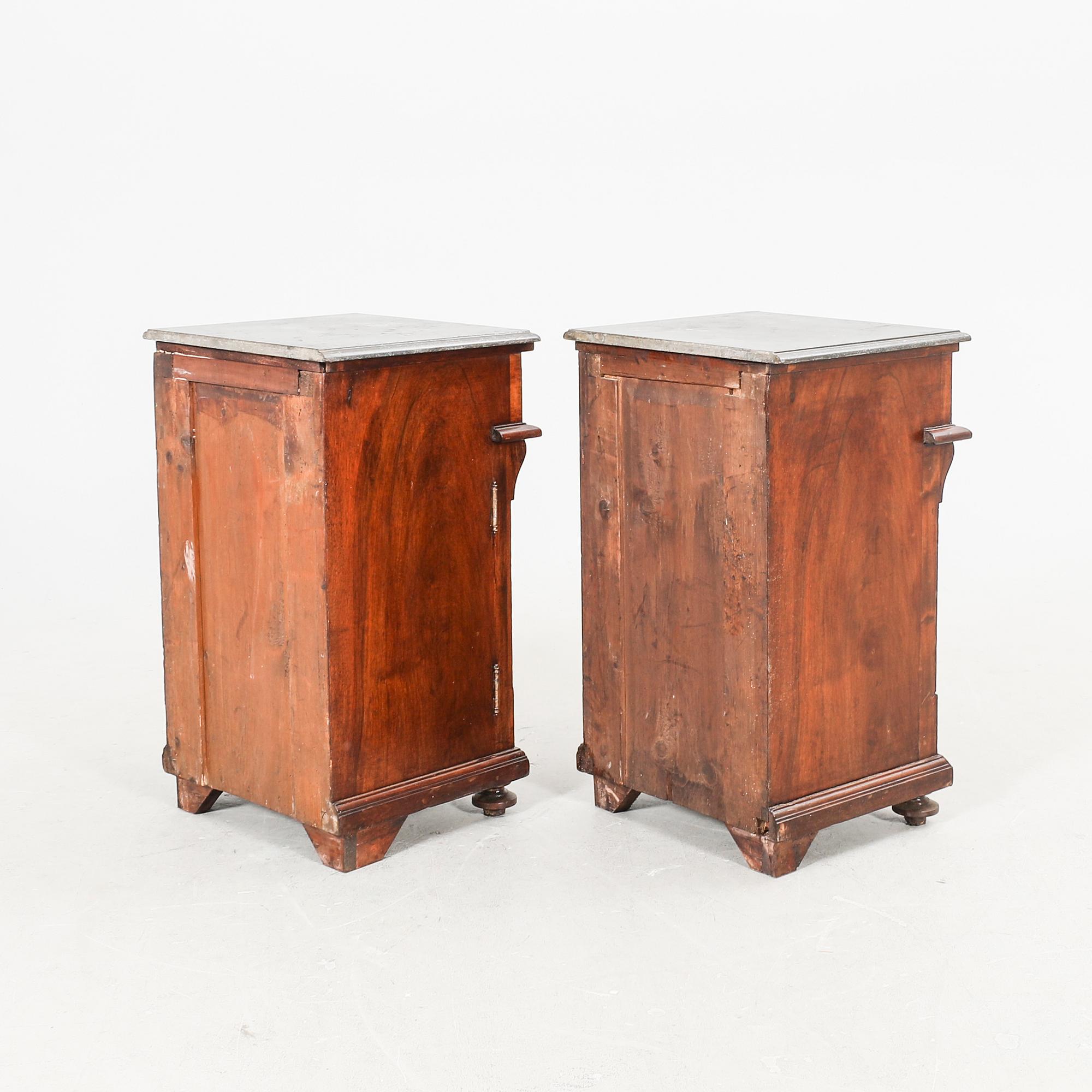 A pair of walnut bedside tables first half of the 20th century.