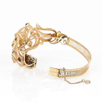 ARMRING, filigranarbete, 18 guld med granater. Stockholm 1860. Vikt ca 25 g.