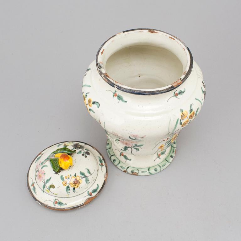 A 20th century urn and lid.