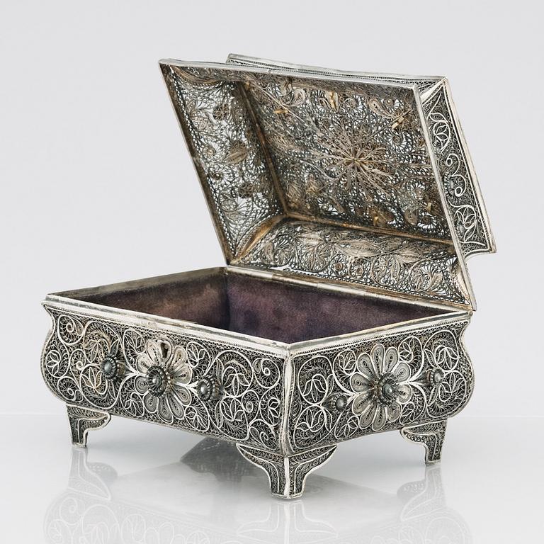 A 19th Century silver filigree box, unidentified makers mark R.K, Assay master mark of Ivan Lebedkin, Moscow 1898-1908.