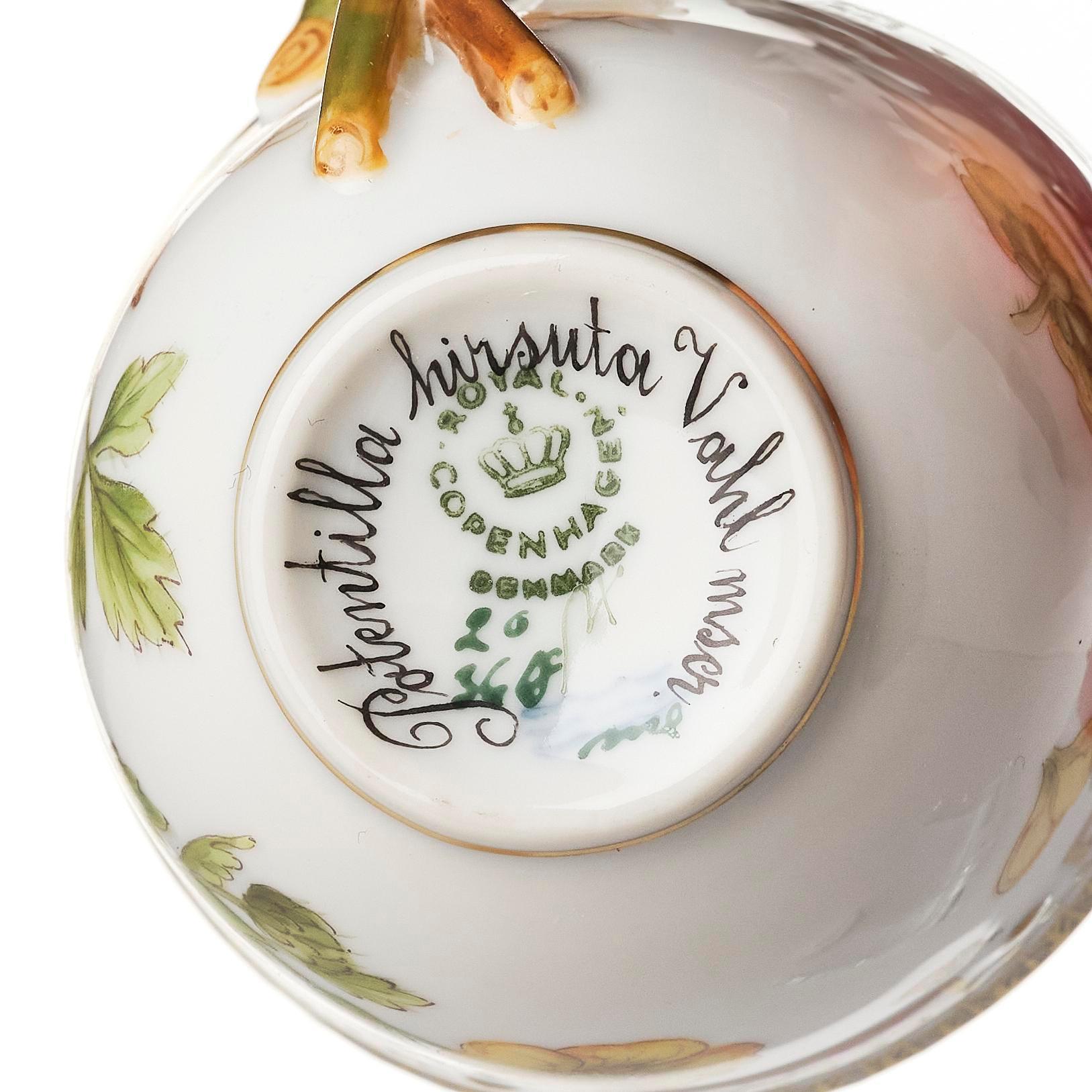 A set of nine Royal Copenhagen 'Flora Danica' cups with saucers, Denmark, 20th century.