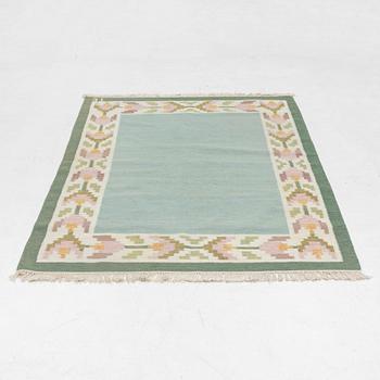 A flat weave carpet, signed TE, c. 224 x 126 cm.