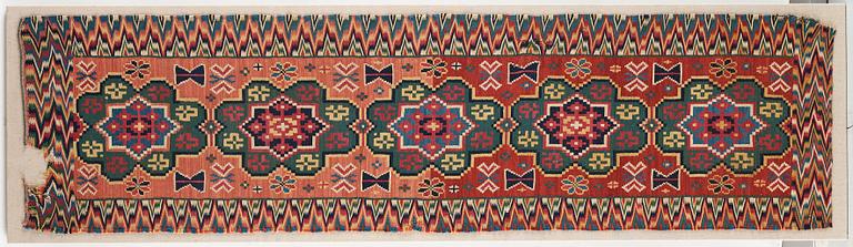 A BENCH CUSHION probably, A FRAGMENT, double-interlocked tapestry, ca 58,5-59,5 x 220-223 cm, Scania (Sweden).