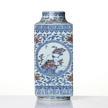 An underglaze blue and copper-red 'crane and deer' cong vase, Qing dynasty, 18/19th century.