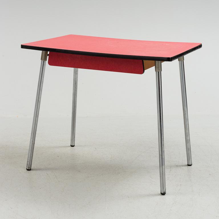 A mid 20th century table and chair.