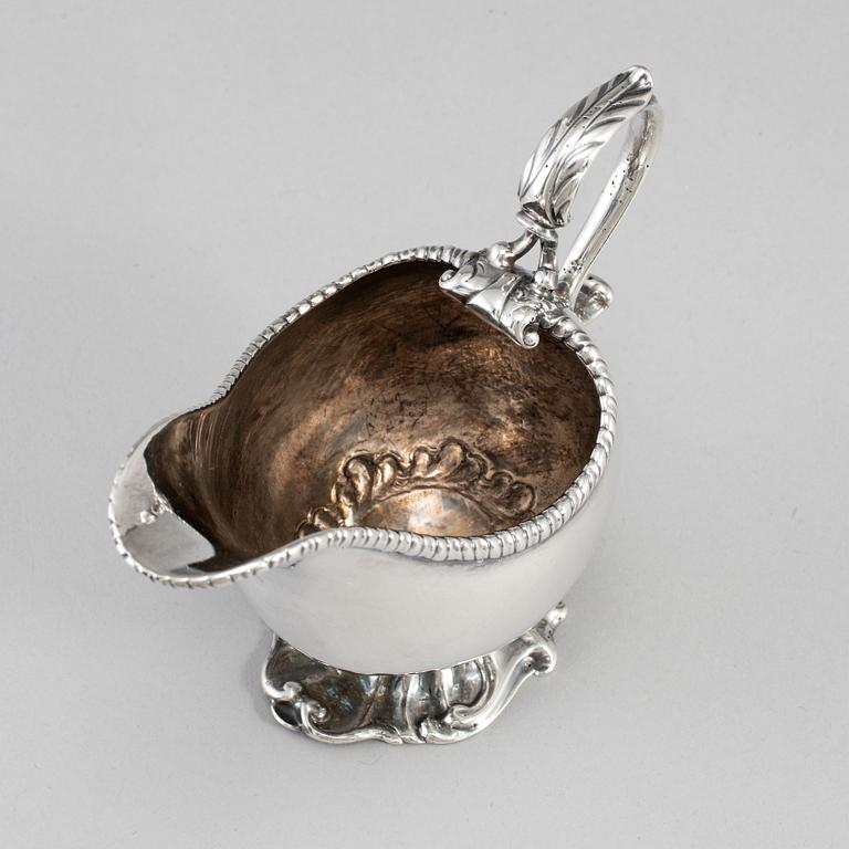 An English 18th century silver sauce-boat, unidentified makers mark, London 1764.