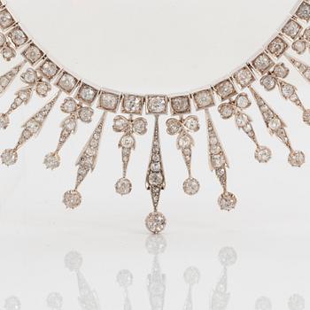 A tiara/necklace combination in 9K gold and silver set with old-cut diamonds with a total weight of ca 12.00 cts.