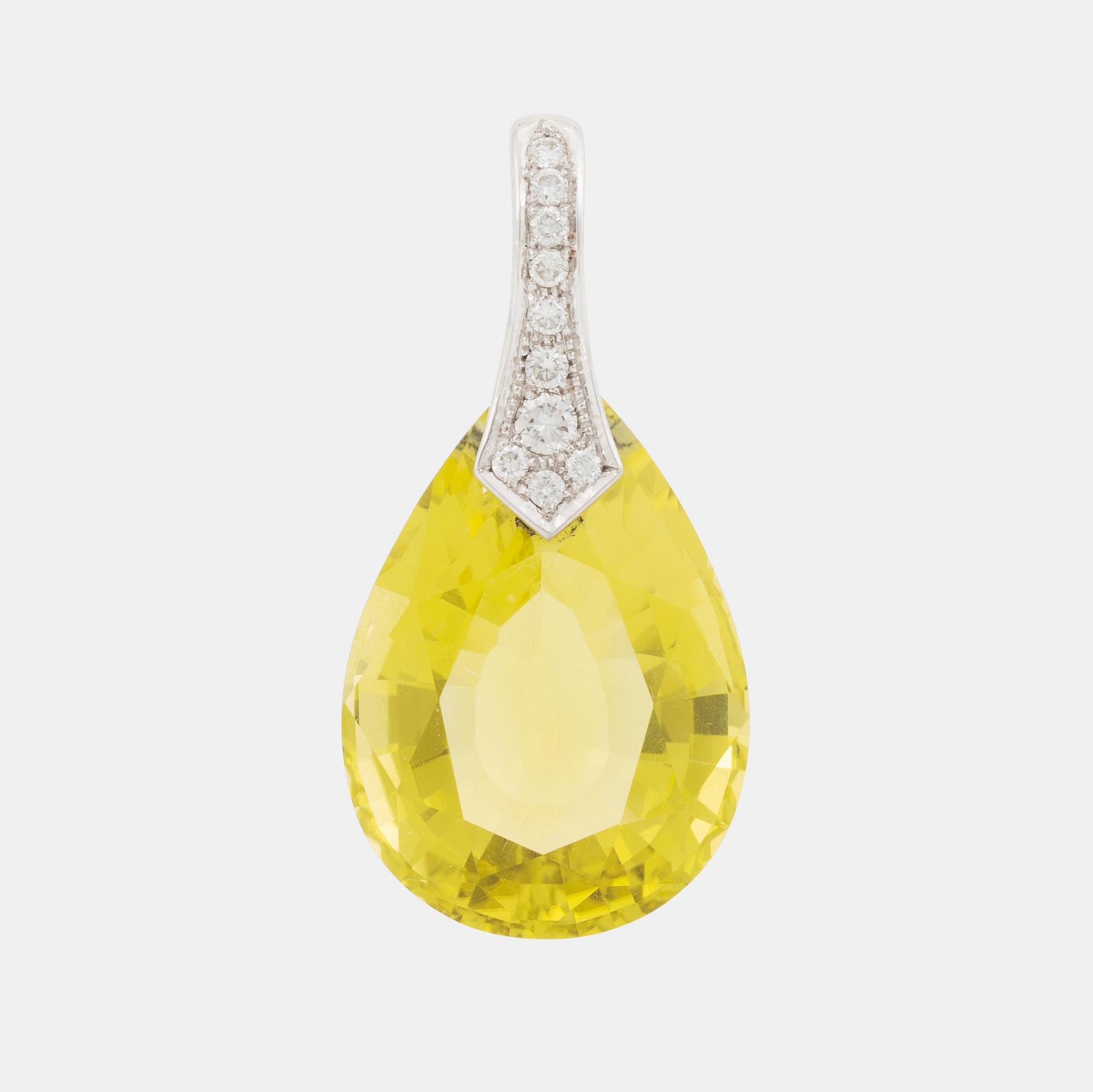 A Tina Karlsson 18K white gold pendant with a faceted helidor.