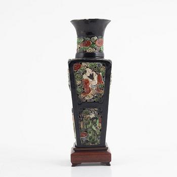 A Chinese famille noire pierced vase, Qing dynasty, 19th century.