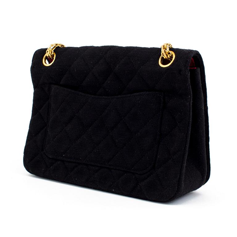 A black quiltet jersey handbag by Chanel.