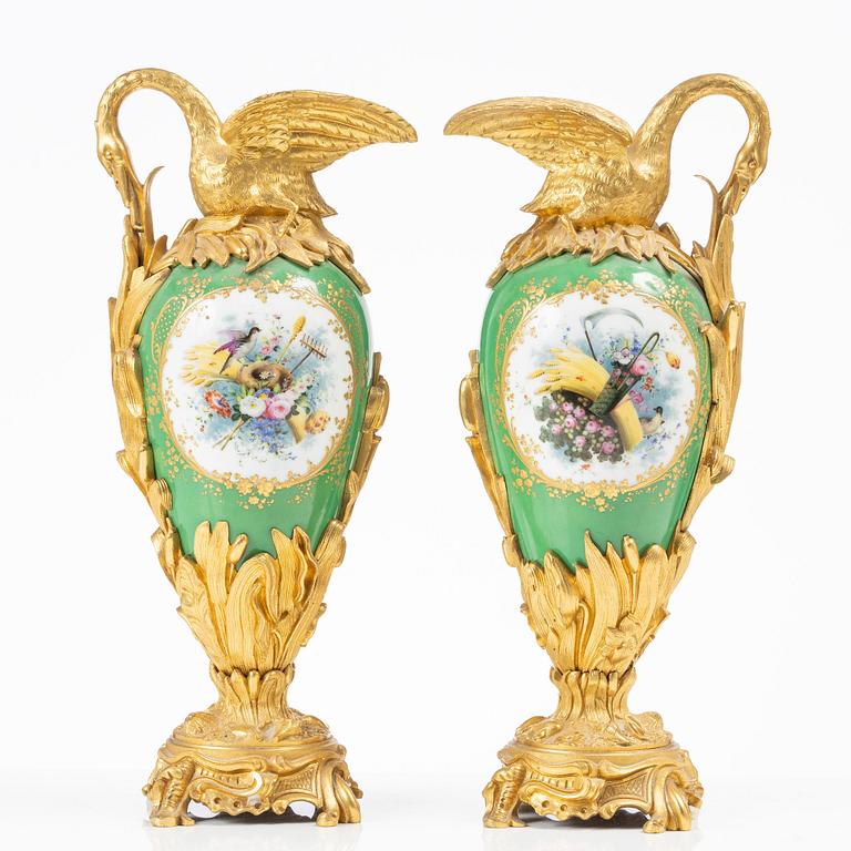 A pair of Louis XV-style gilt bronze and porcelain decorative ewers, France, later part 19th century.