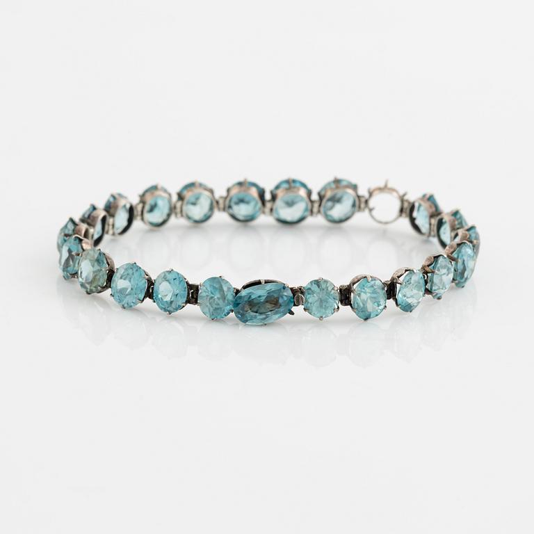 Silver and blue zircon bracelet.