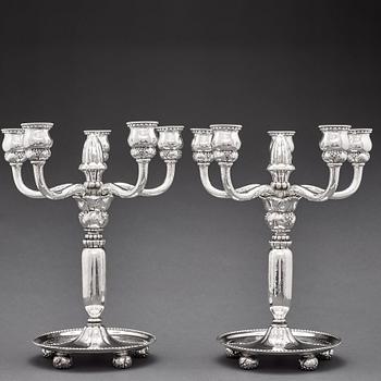 Georg Jensen, a pair of 830/1000 silver five light candelabra, Copenhagen 1920, design nr 200.