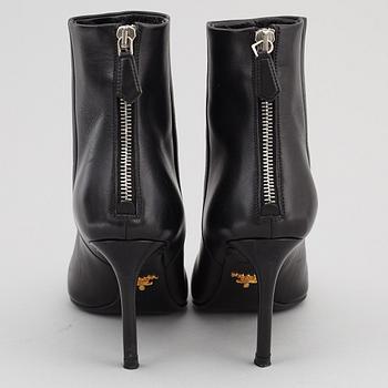 PRADA, a pair of black leather boots, size 35.