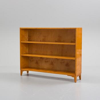 A mid 20th century birch veneered shelf.