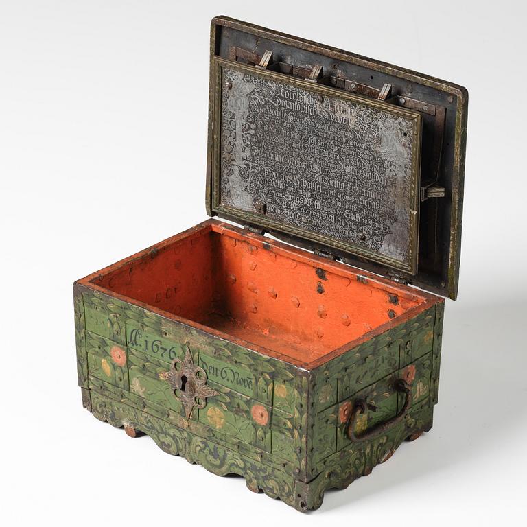 A Baroque South German engraved and polychrome-painted iron and steel strongbox, later part of the 17th century.