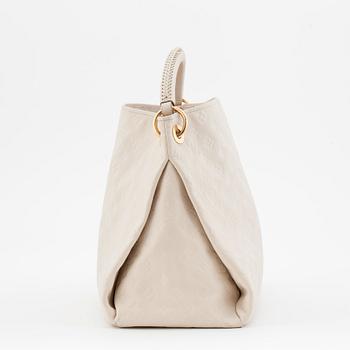 LOUIS VUITTON, a creme colored shoulder bag with embossed monogram print, "Artsy MM".