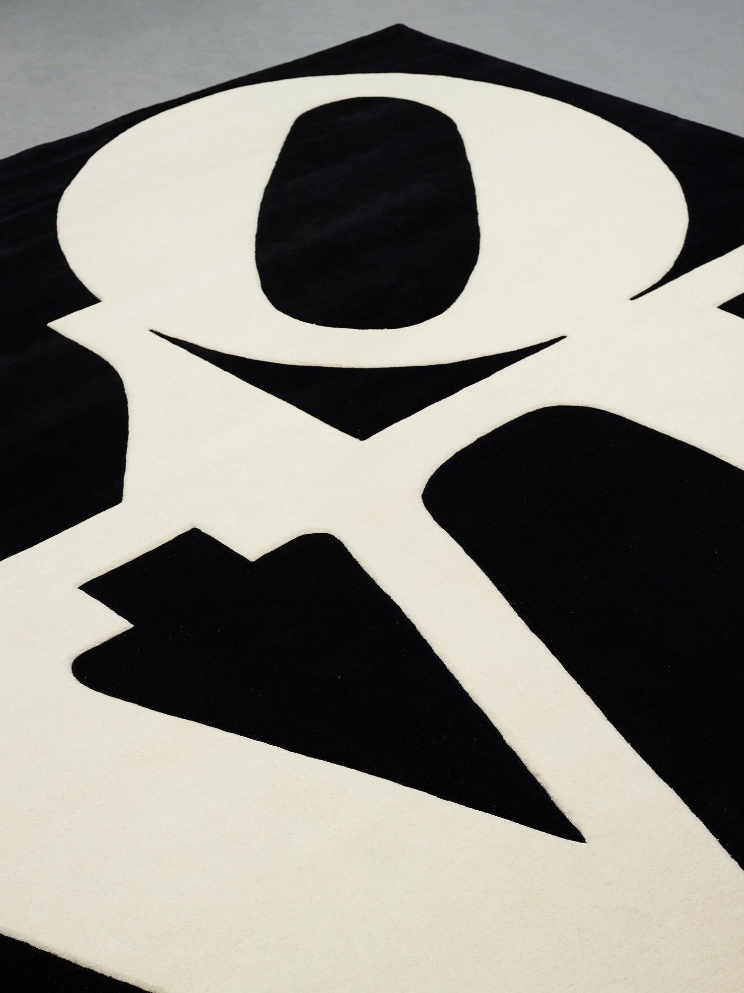 Robert Indiana, A CARPET, "White on Black", Chosen Love, hand tufted in 1995, ca 302 x 305 cm, Robert Indiana.