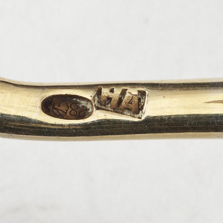 A Russian silver-gilt and enamel spoon, unidentified makers mark, Moscow 1899-1908.